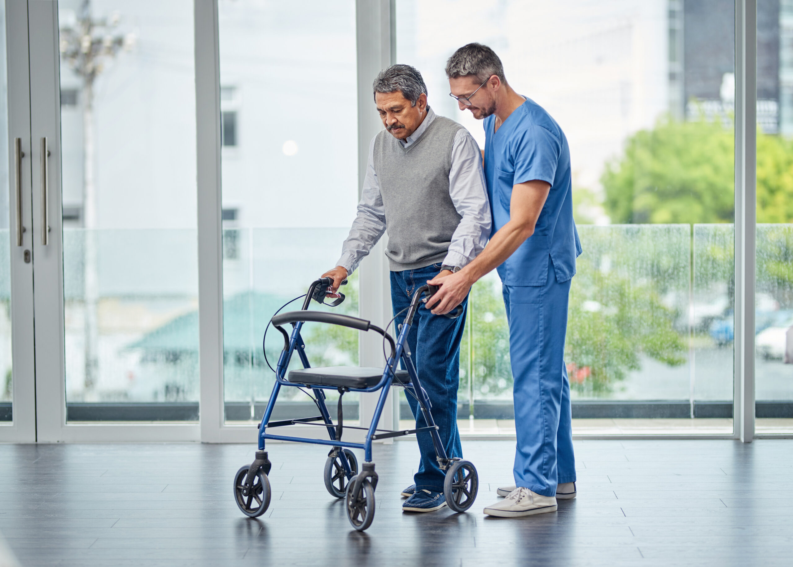 Improving Mobility Impairment One Step At A Time. Shot Of A Nurs